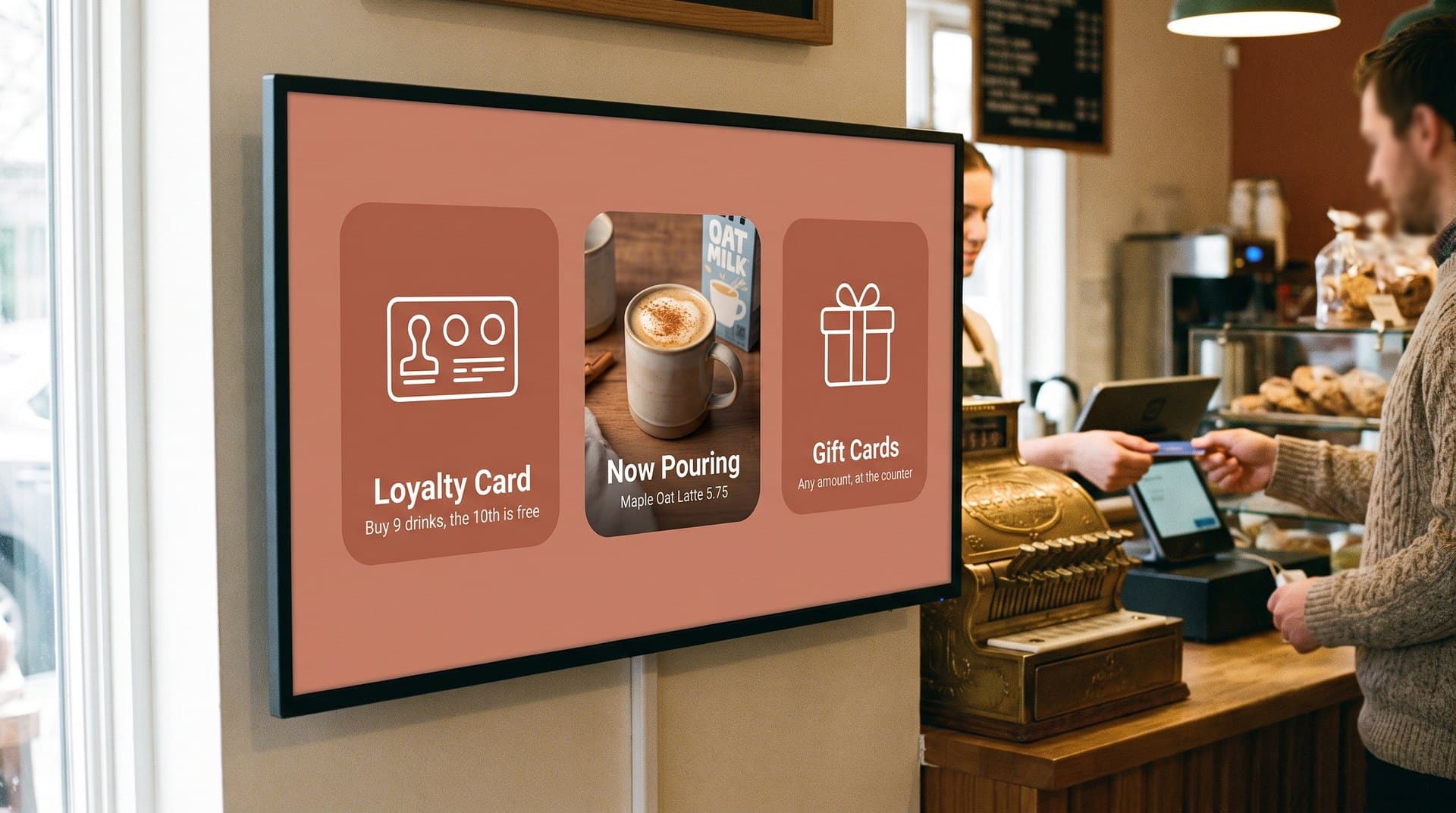 Cafe screen rotating a loyalty card, a seasonal latte, and gift cards