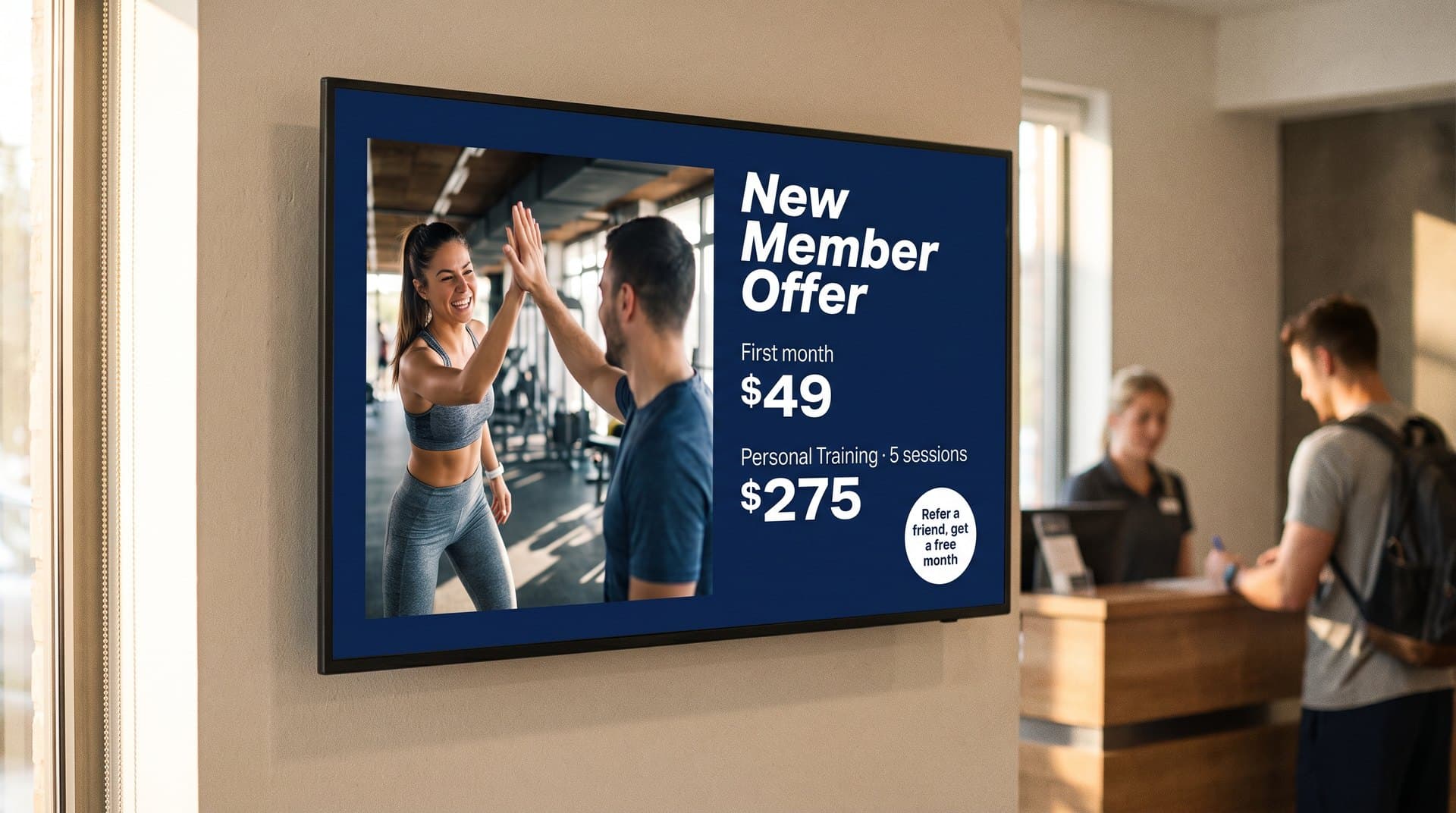 Gym lobby screen with a new-member offer and personal training package