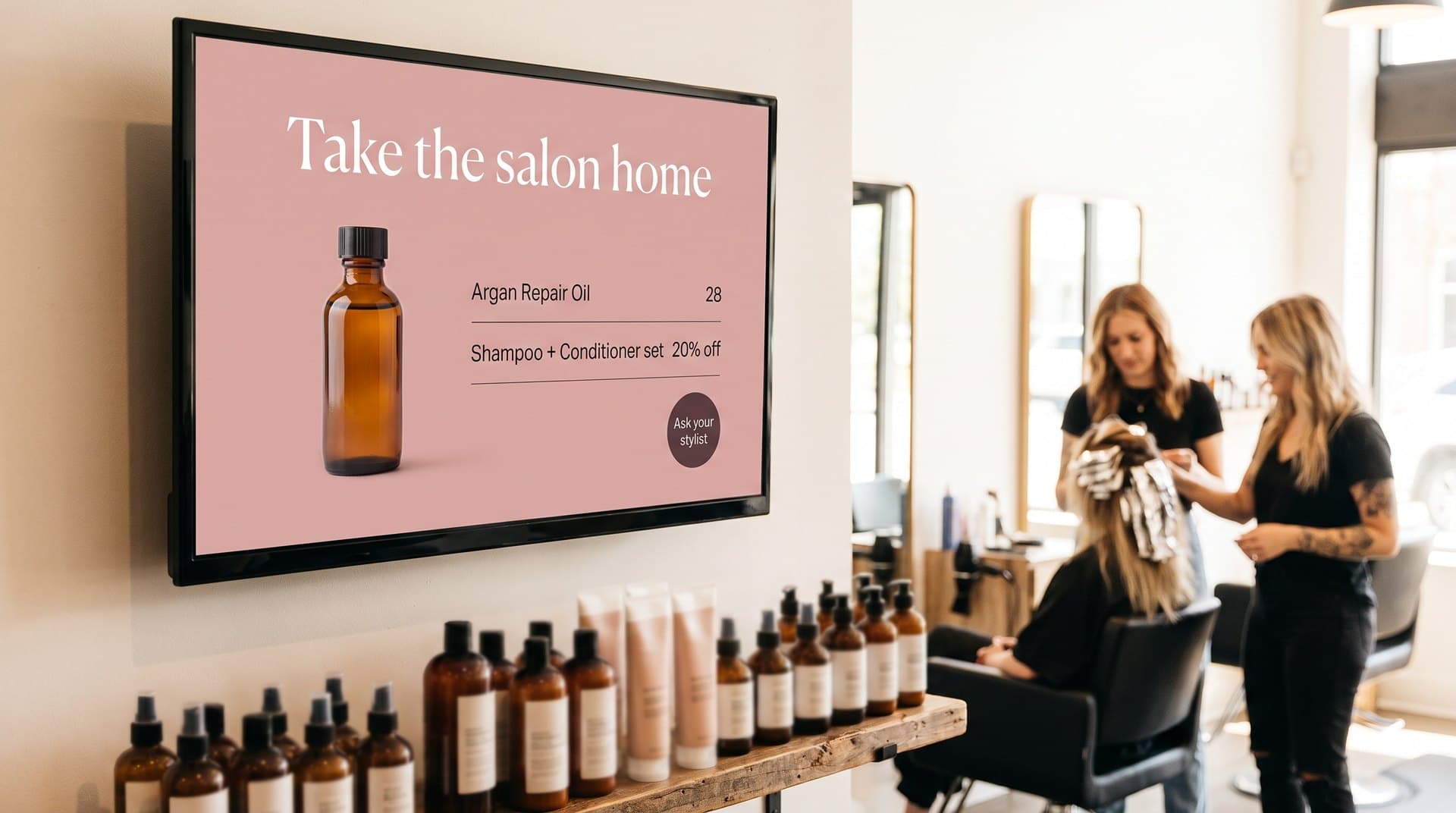 Salon screen above the retail shelf promoting a product and bundle